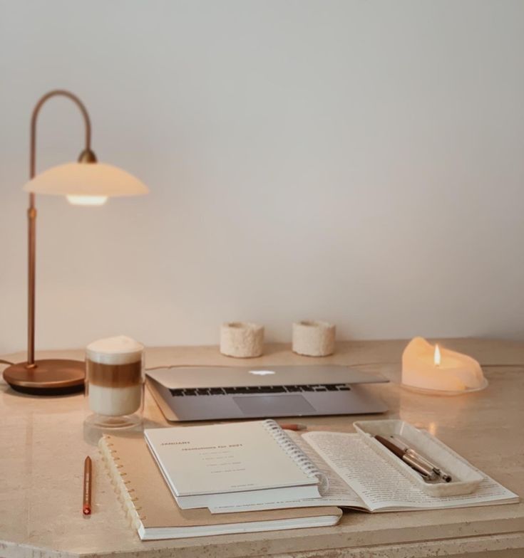  Organized morning workspace with journal and warm lighting